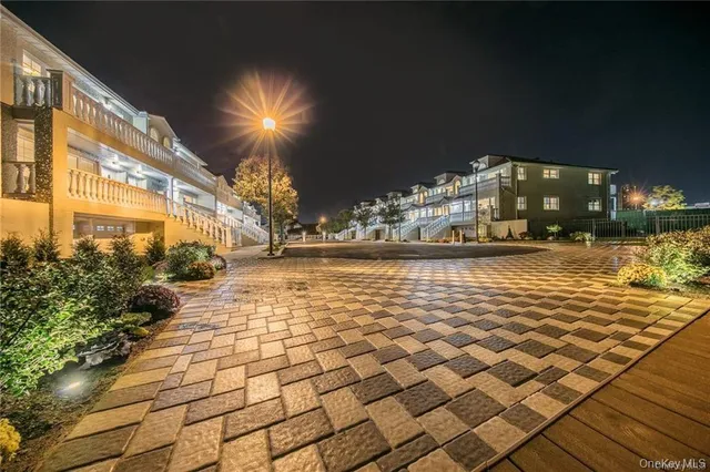 a view of a house with backyard and deck