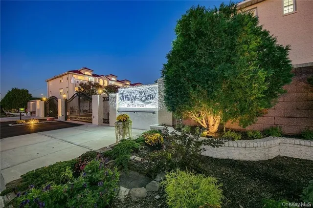 a view of a balcony with wooden floor and fence