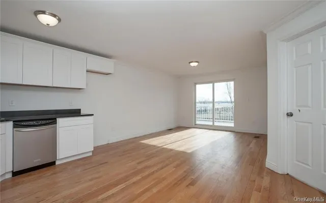 a view of kitchen with wooden floor