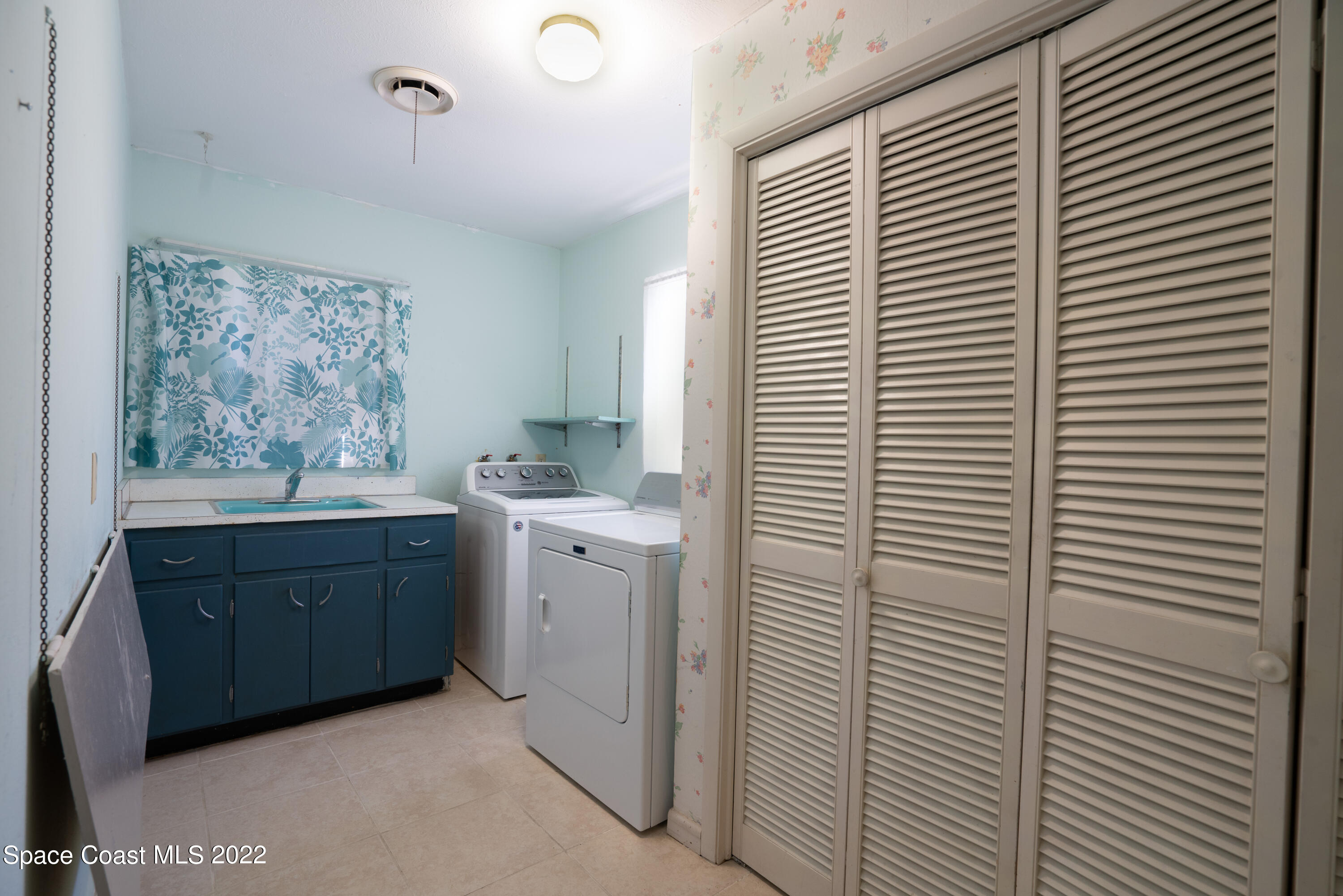 111 Highview Drive Cocoa, FL 32922 - Photo 17 of 17 a room with window and cabinet
