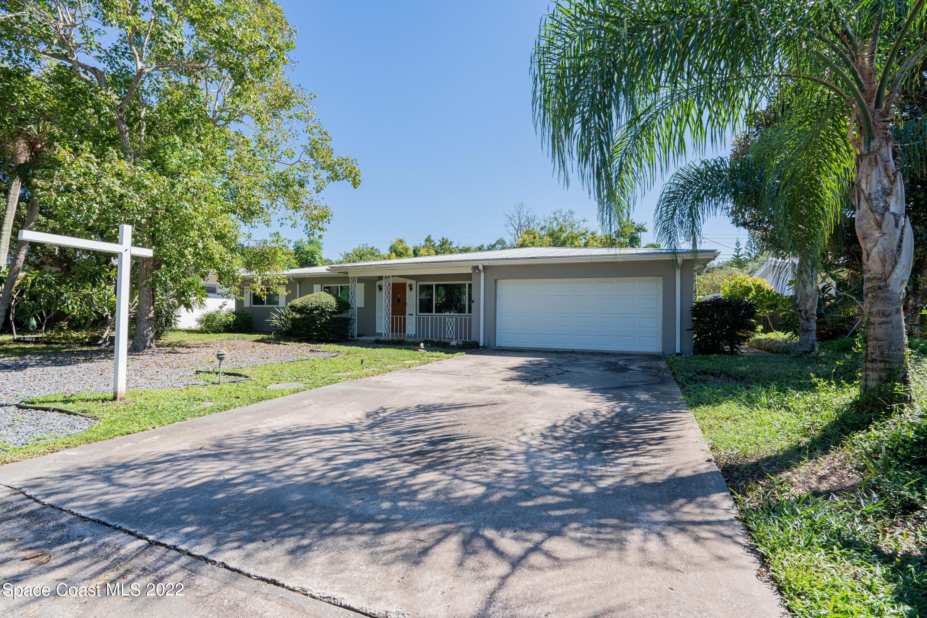 111 Highview Drive Cocoa, FL 32922 - Photo 2 of 17 a view of a house with a yard and tree