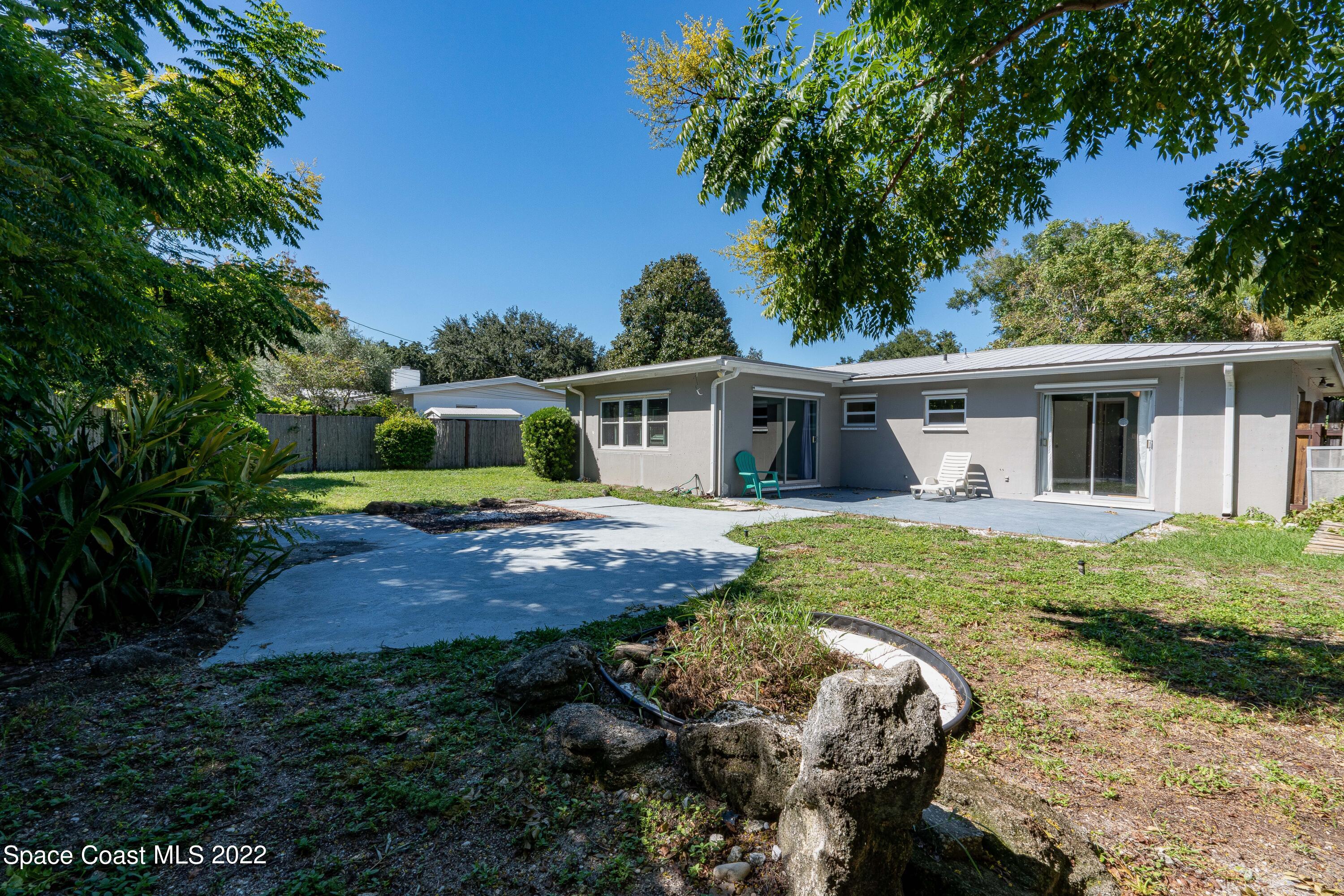 111 Highview Drive Cocoa, FL 32922 - Photo 4 of 17 a front view of a house with garden