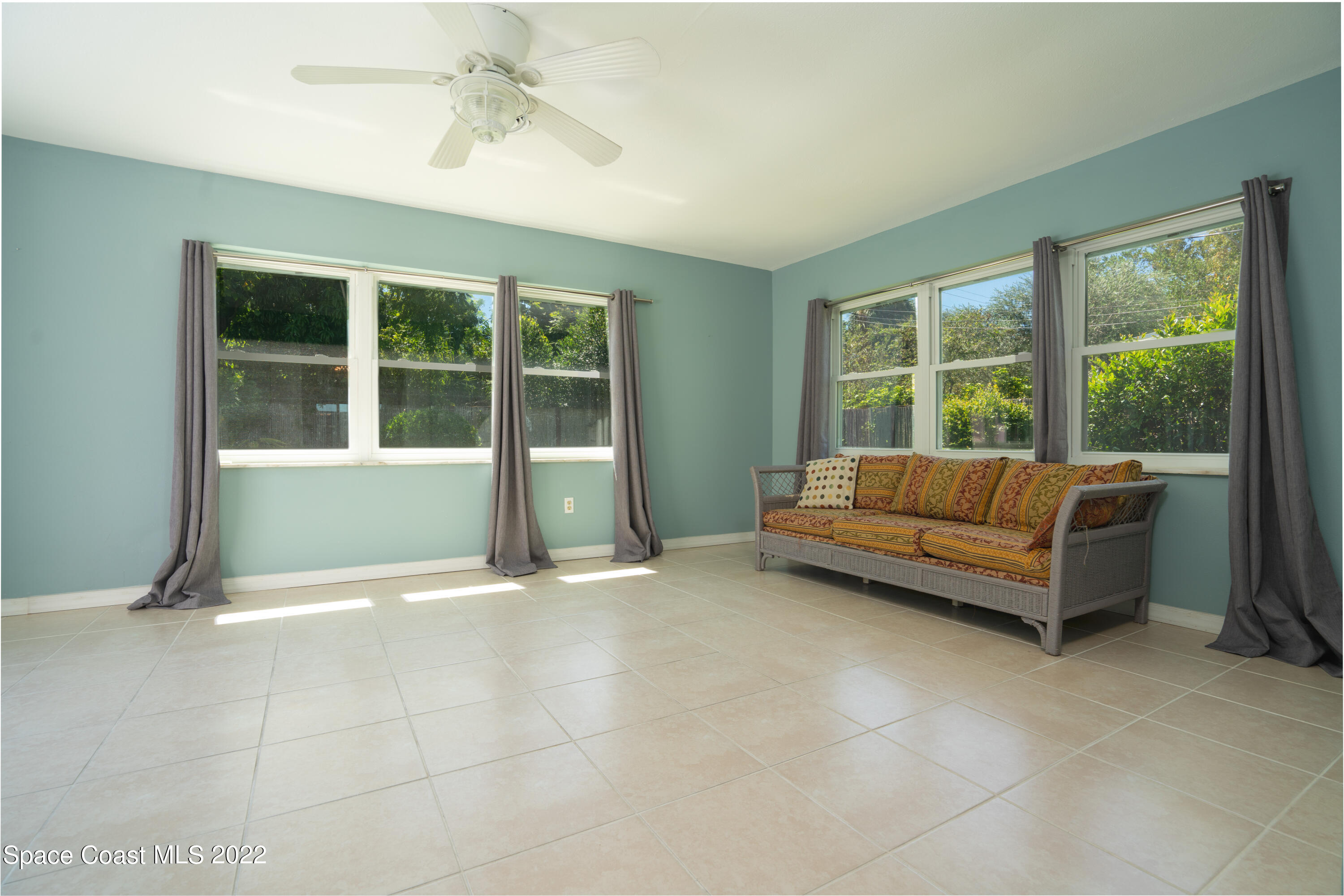 111 Highview Drive Cocoa, FL 32922 - Photo 9 of 17 a living room with a couch and a window
