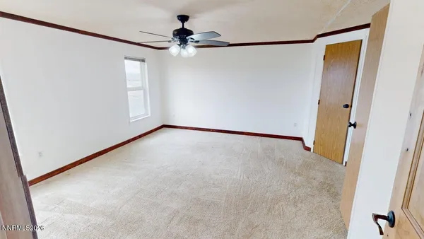 a view of an empty room with a bathroom