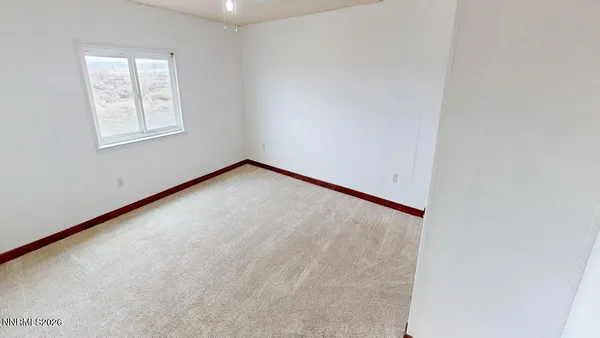 a view of a room with a wooden floor