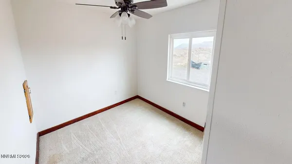 a view of an empty room with windows