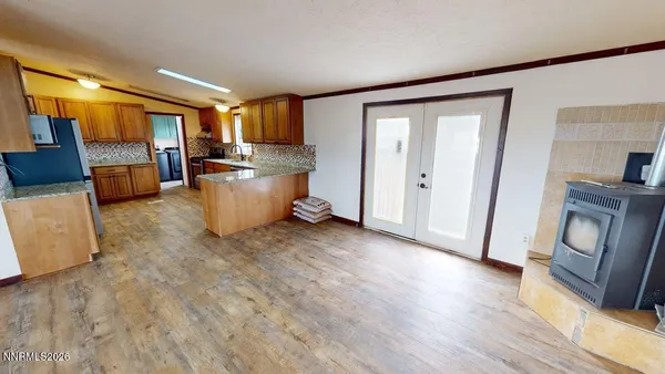 a view of a hallway with wooden floor and stairs