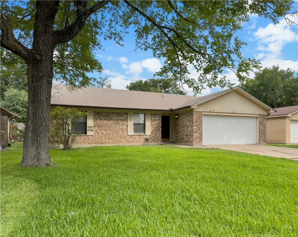 a front view of house with yard and outdoor seating