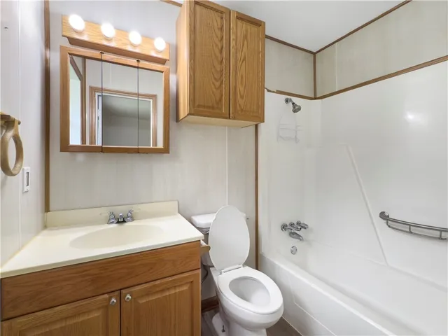 a bathroom with a sink a mirror and a toilet