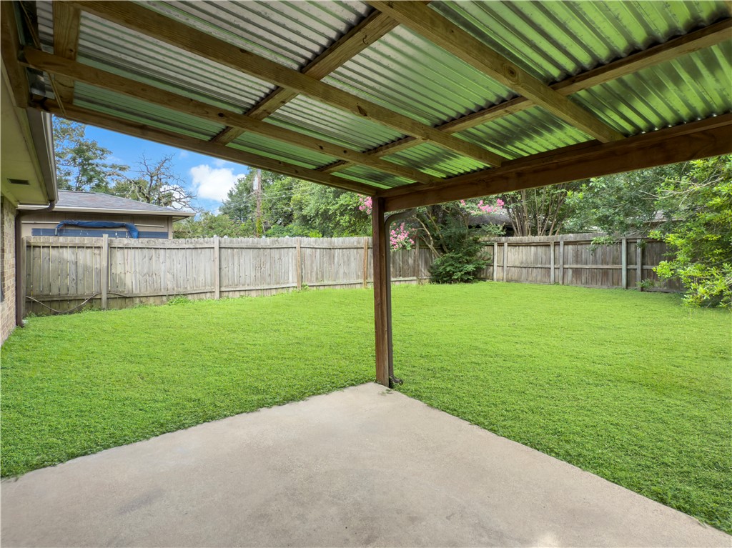 3234 Red Robin Loop Bryan, TX 77802 - Photo 17 of 19 a view of a backyard with a garden