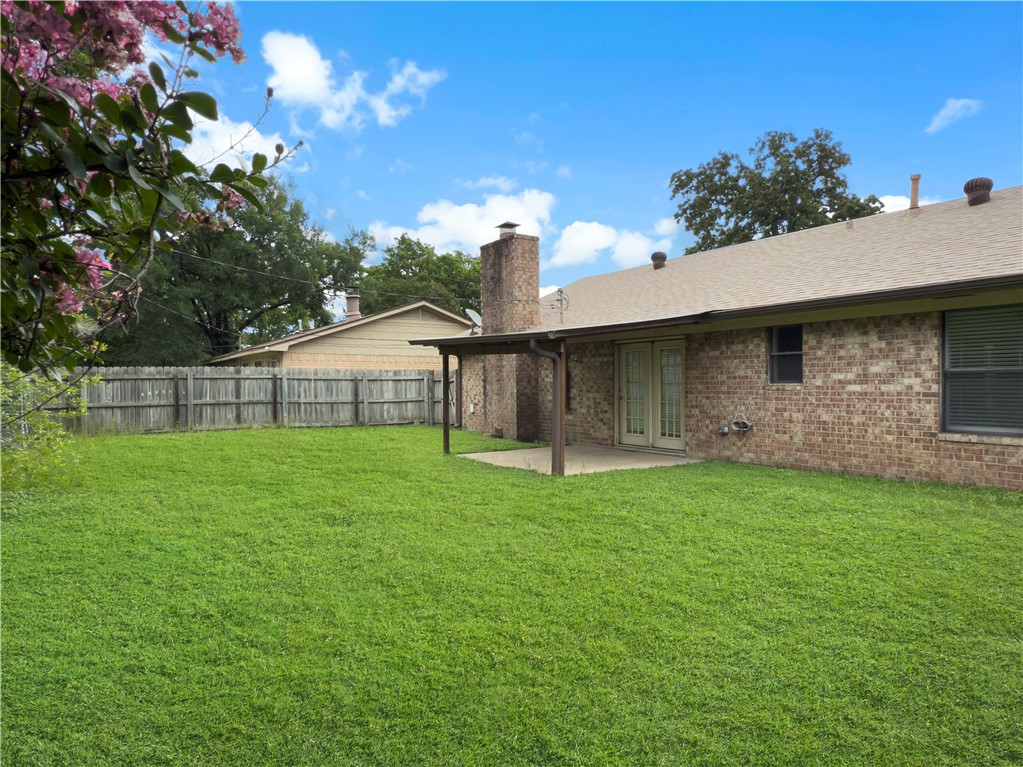 3234 Red Robin Loop Bryan, TX 77802 - Photo 18 of 19 a front view of a house with a yard