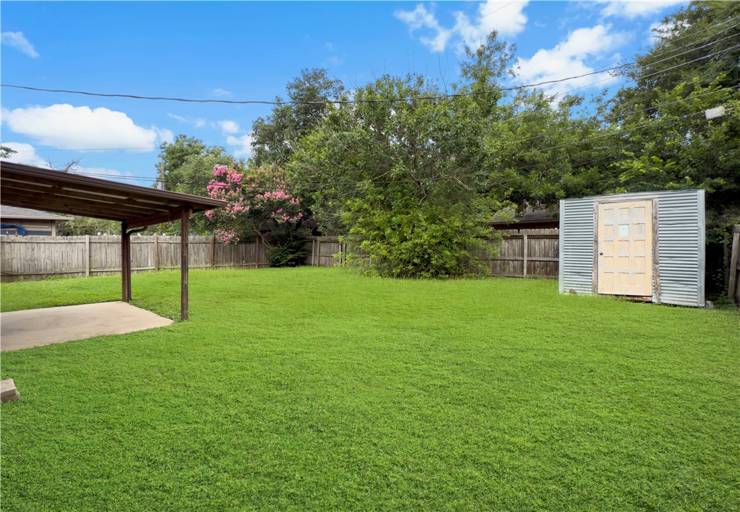 3234 Red Robin Loop Bryan, TX 77802 - Photo 19 of 19 a view of a backyard with a garden