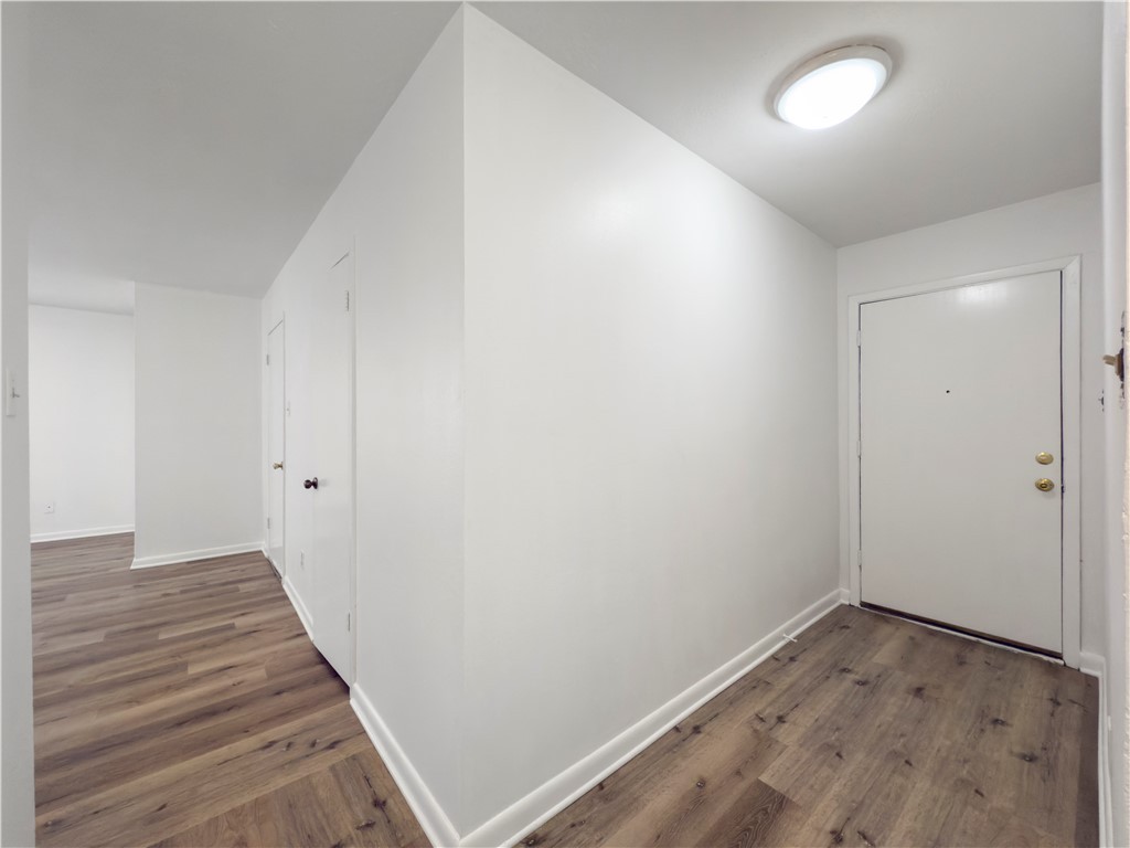 3234 Red Robin Loop Bryan, TX 77802 - Photo 3 of 19 a view of a hallway with wooden floor