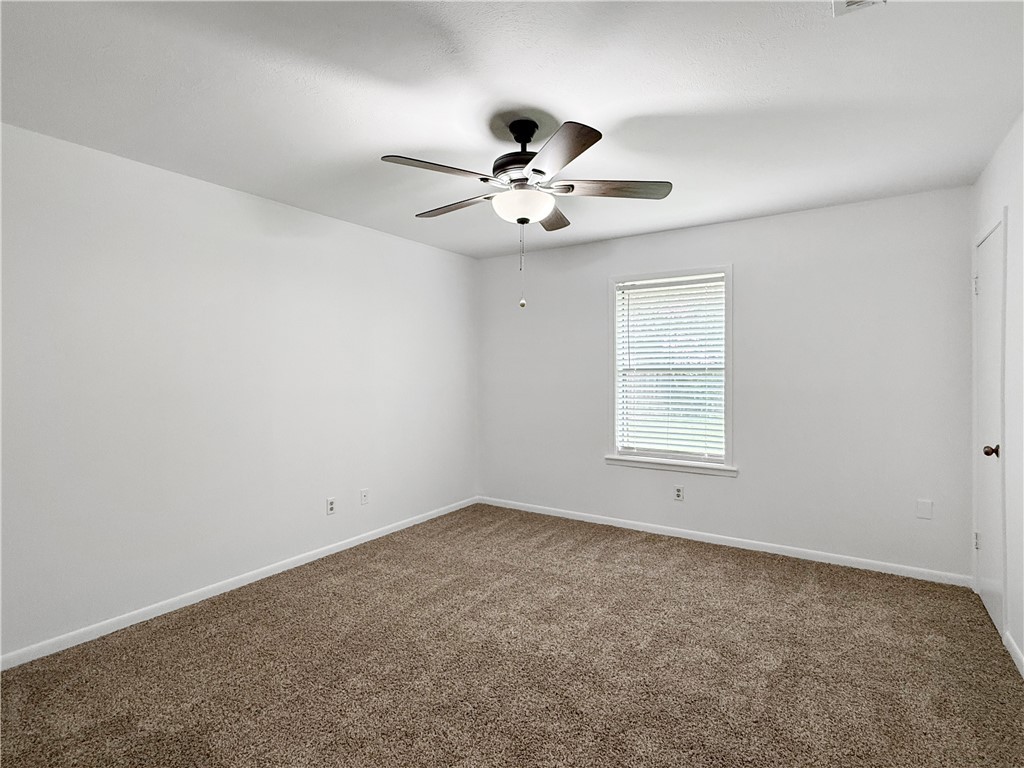 3234 Red Robin Loop Bryan, TX 77802 - Photo 10 of 19 an empty room with a window and ceiling fan