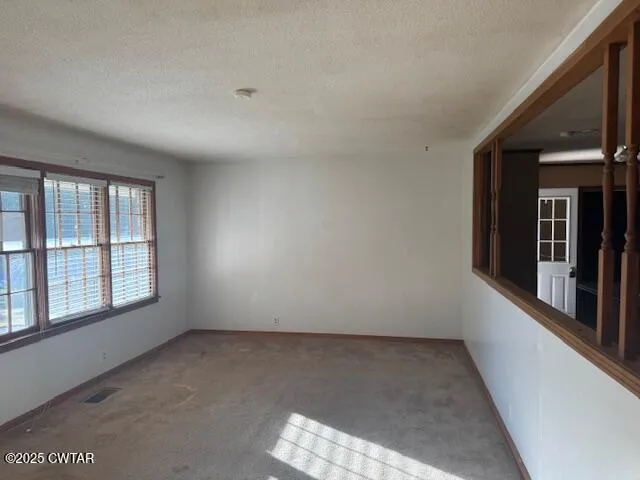 en empty room with windows