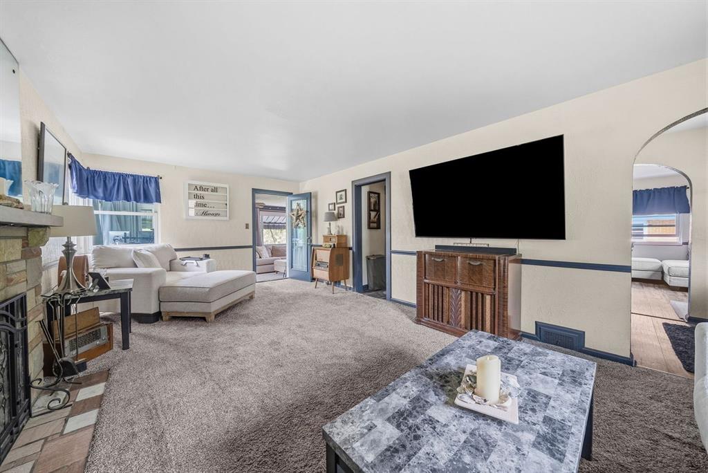 4768 Rolling Hills Road Pittsburgh, PA 15236 - Photo 6 of 46 a living room with furniture and a flat screen tv