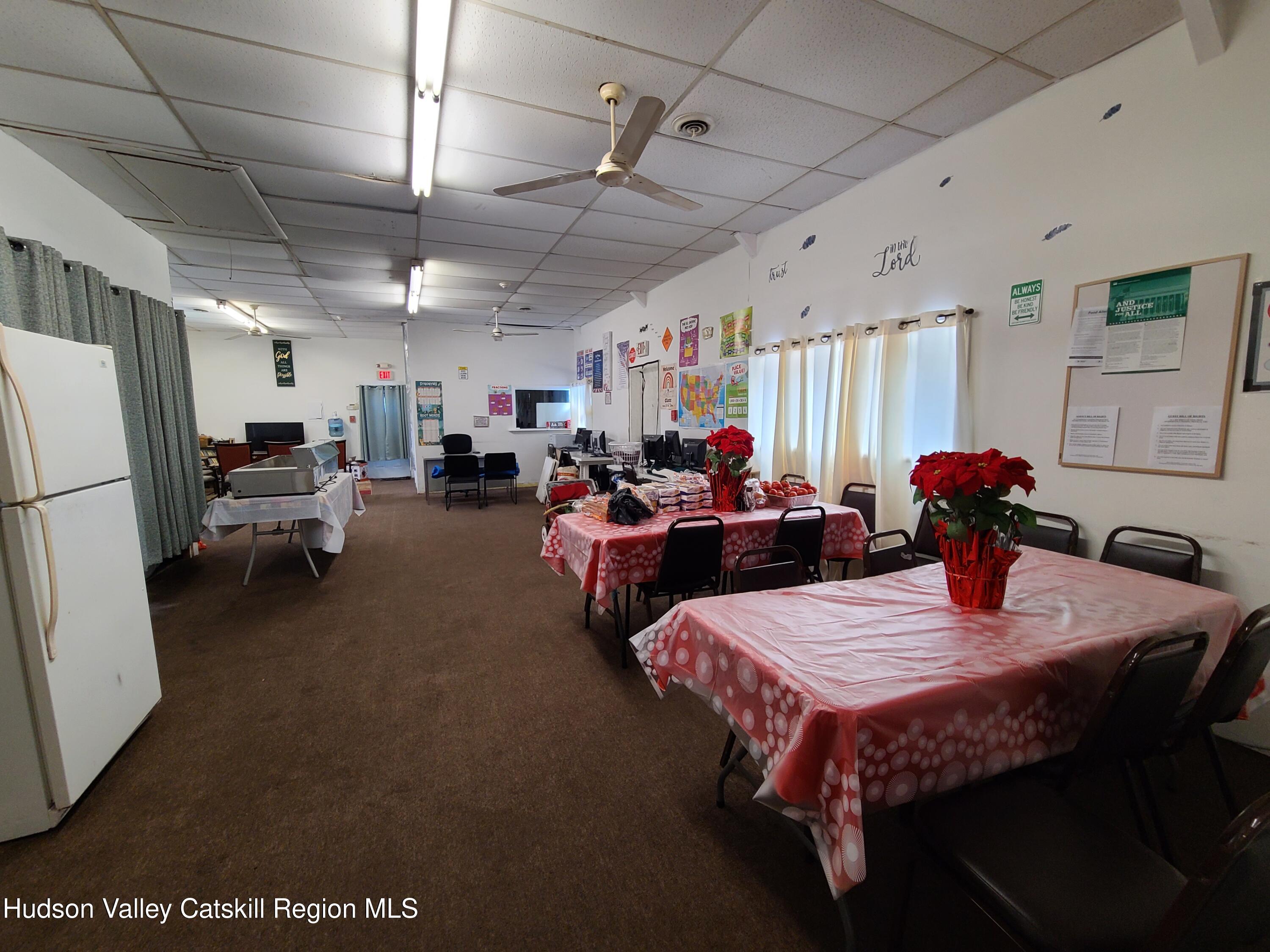 36 Cold Spring Road Monticello, NY 12701 - Photo 16 of 35 a living room with furniture and a chandelier