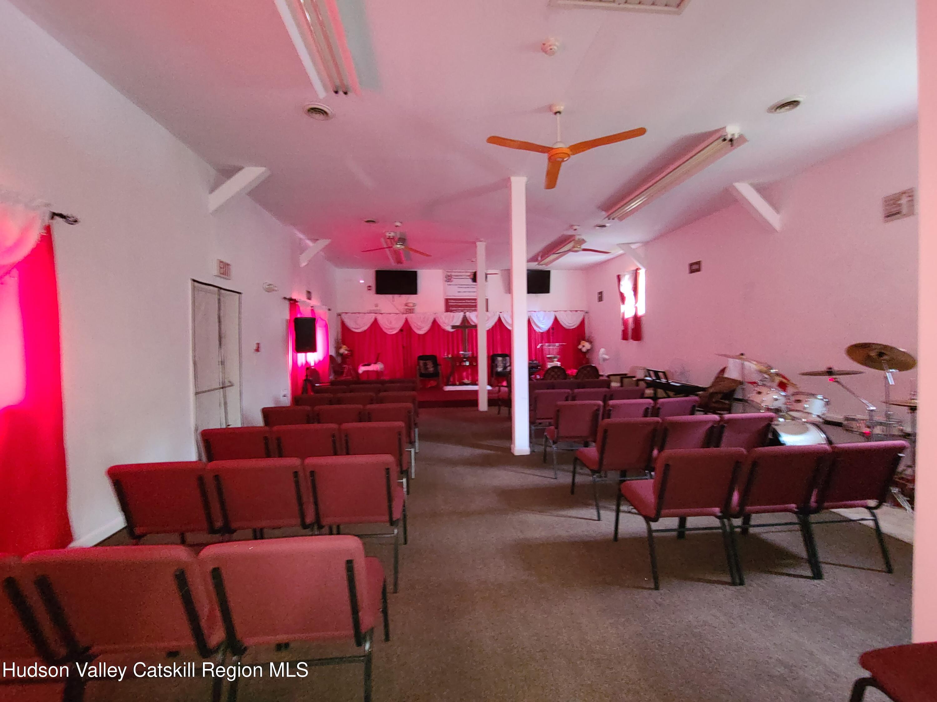 36 Cold Spring Road Monticello, NY 12701 - Photo 17 of 35 a living room with lots of furniture and dining room