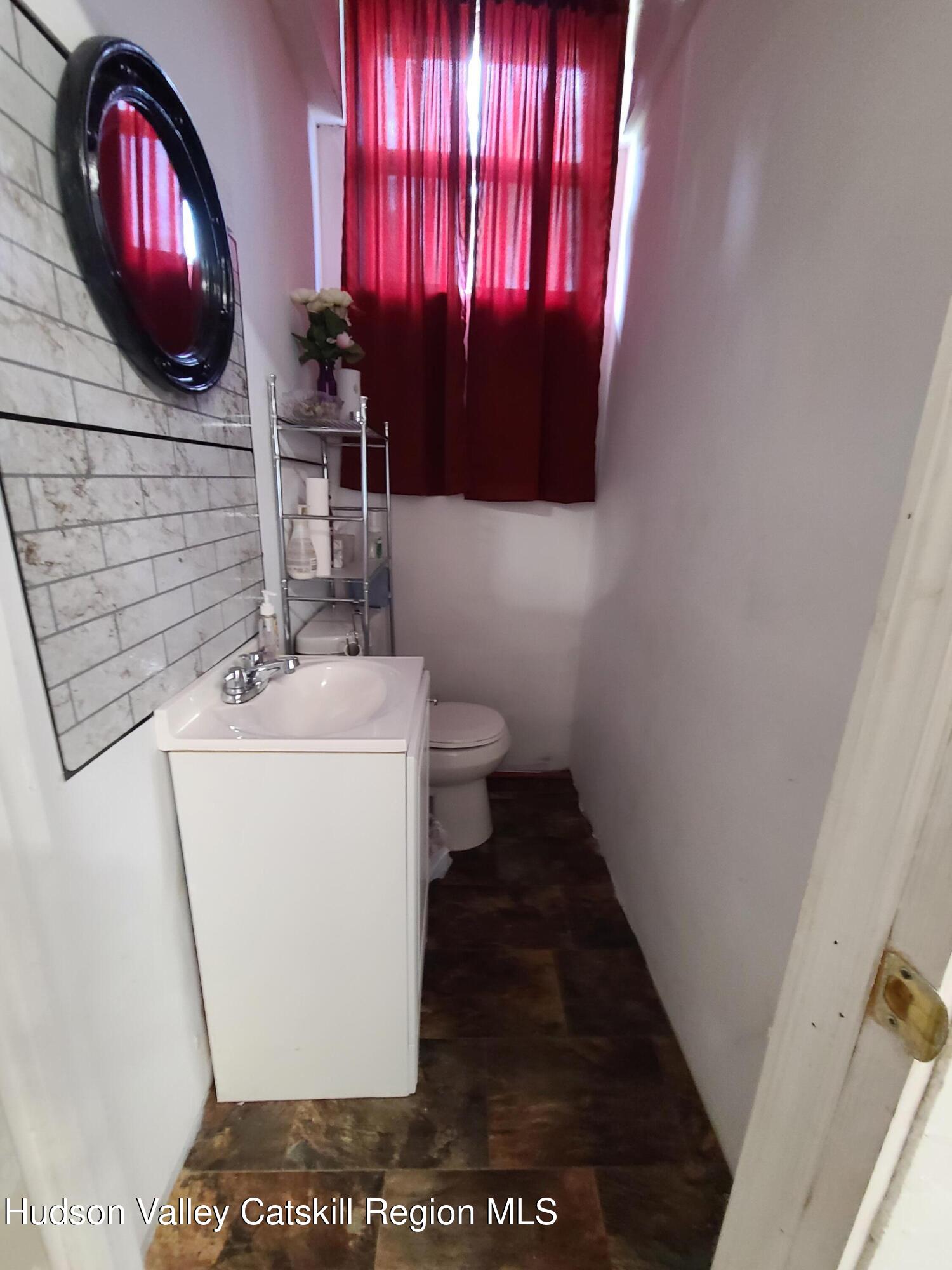 36 Cold Spring Road Monticello, NY 12701 - Photo 20 of 35 a bathroom with a sink and a mirror