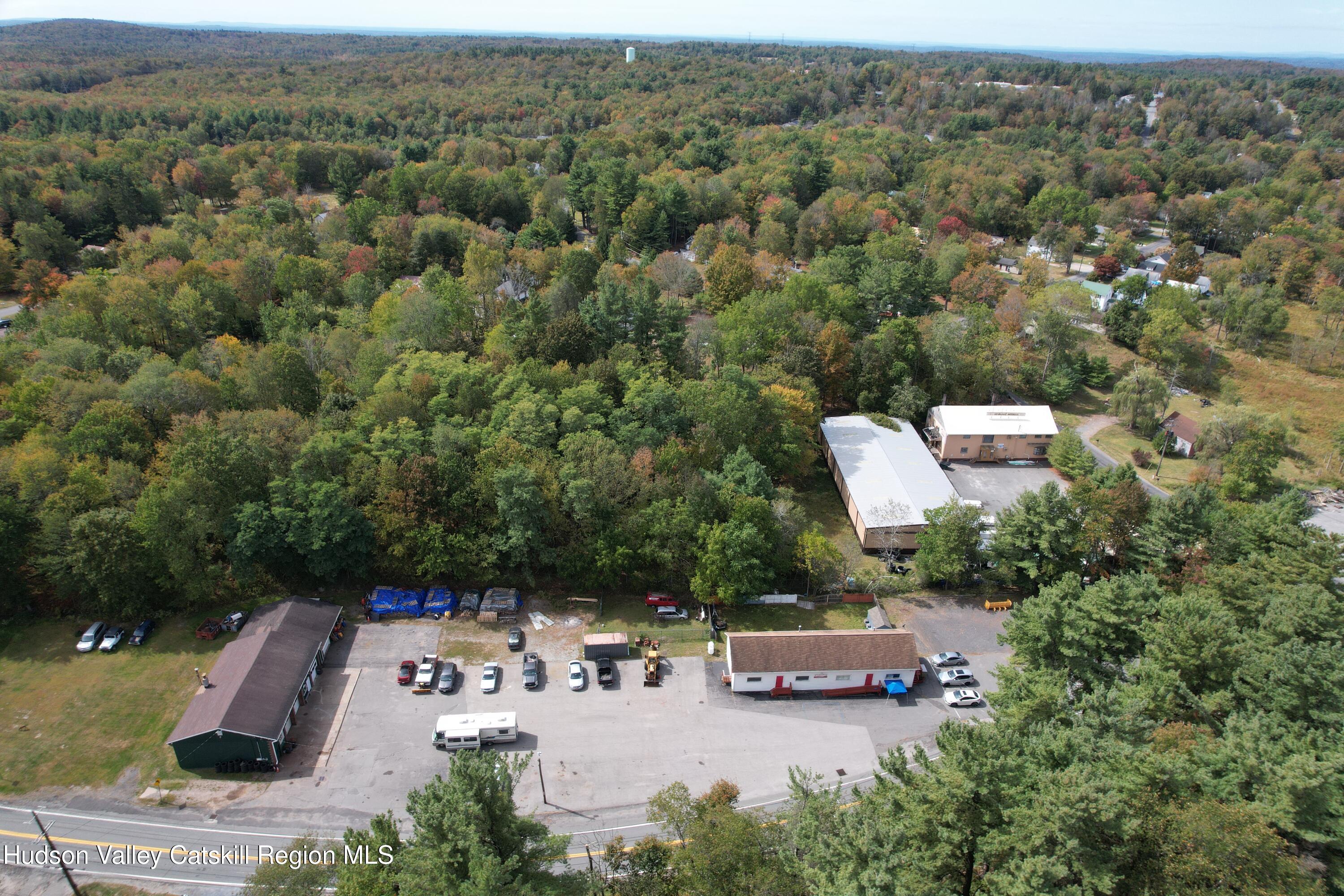 36 Cold Spring Road Monticello, NY 12701 - Photo 27 of 35 an aerial view of a house with a garden