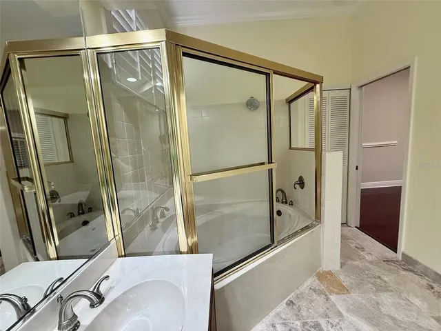 a bathroom with a tub and a shower
