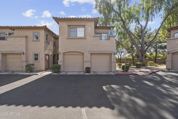 a kitchen with kitchen island granite countertop a stove top oven microwave and cabinets