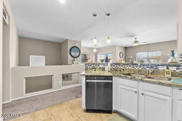 a kitchen with a sink and cabinets