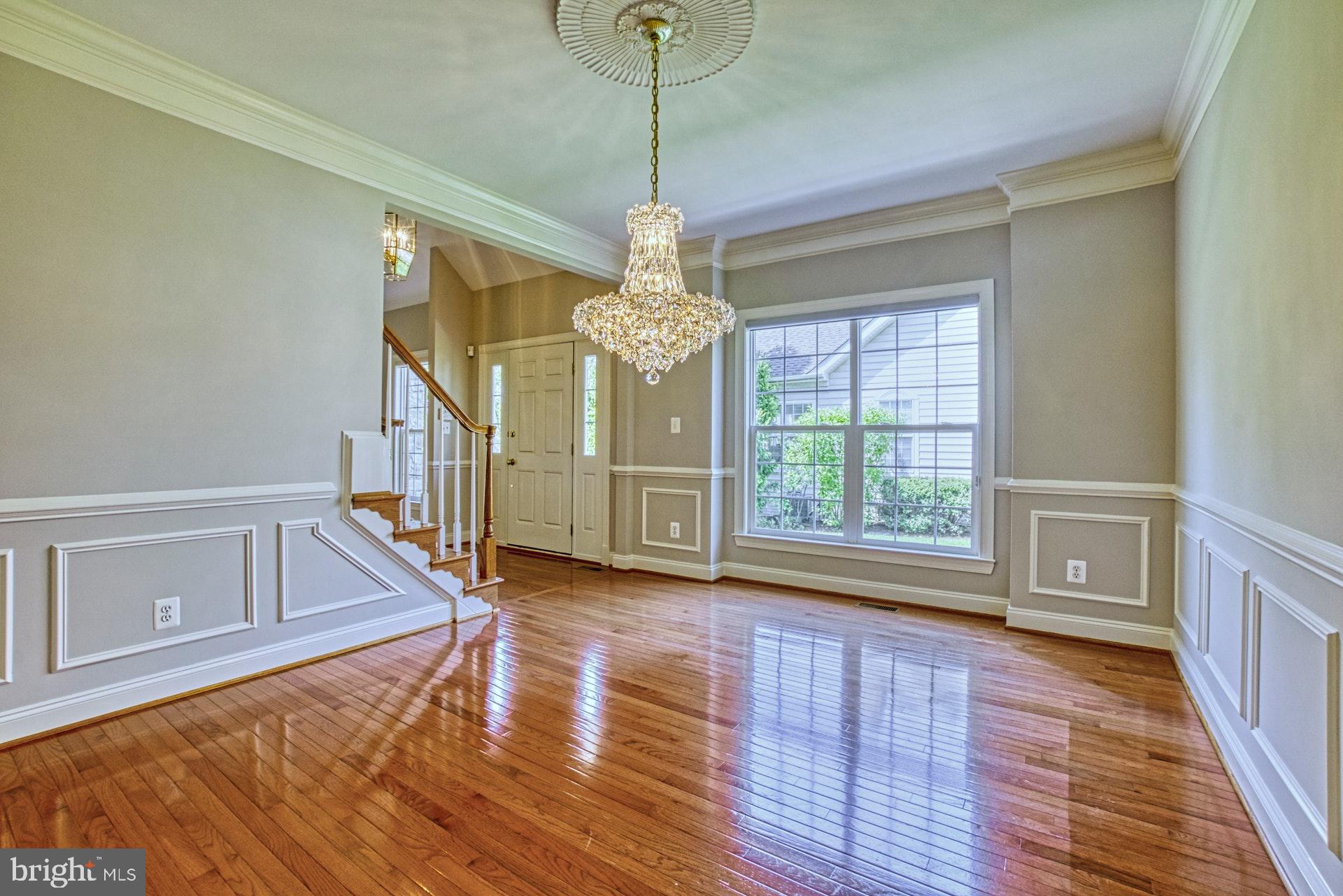 20052 Valhalla Square Ashburn, VA 20147 - Photo 5 of 30 FORMAL DINING ROOM WITH ELEGANT CHANDELIER
