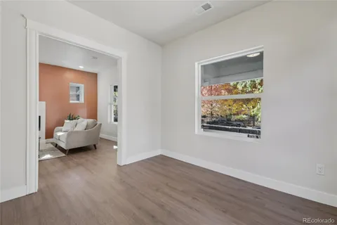 a en suite bathroom with a toilet sink and mirror