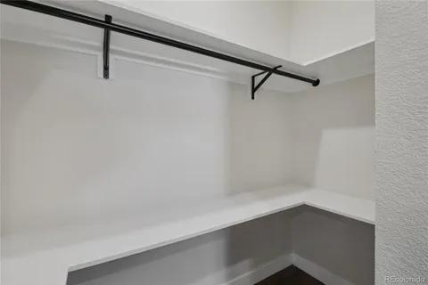a view of a kitchen with wooden floor and a kitchen