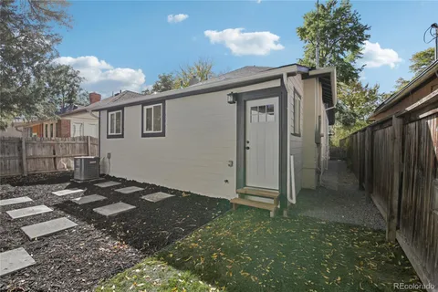 a view of backyard with a patio