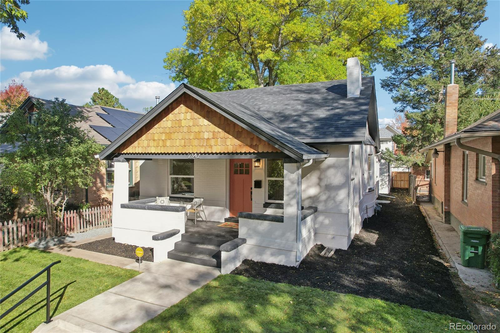 2342 Dexter Street Denver, CO 80207 - Photo 4 of 50 a backyard of a house with seating space
