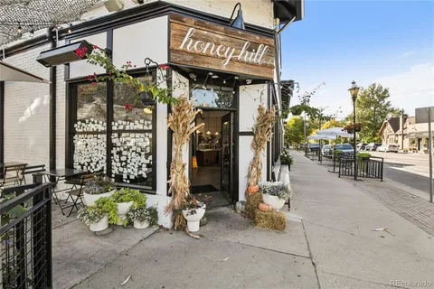 a view of a cars parked on the side of a street