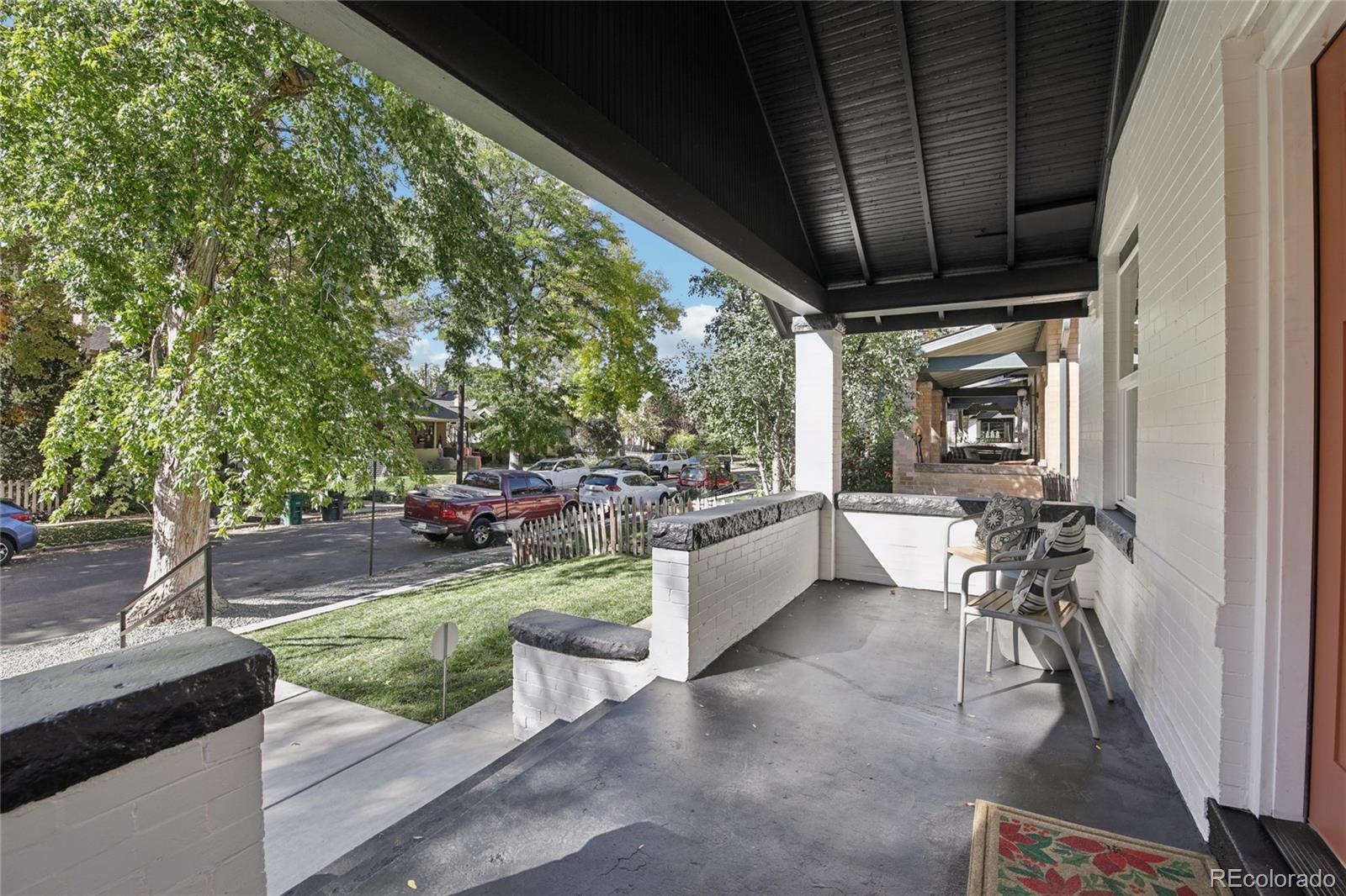 2342 Dexter Street Denver, CO 80207 - Photo 5 of 50 a view of a porch with furniture and a backyard