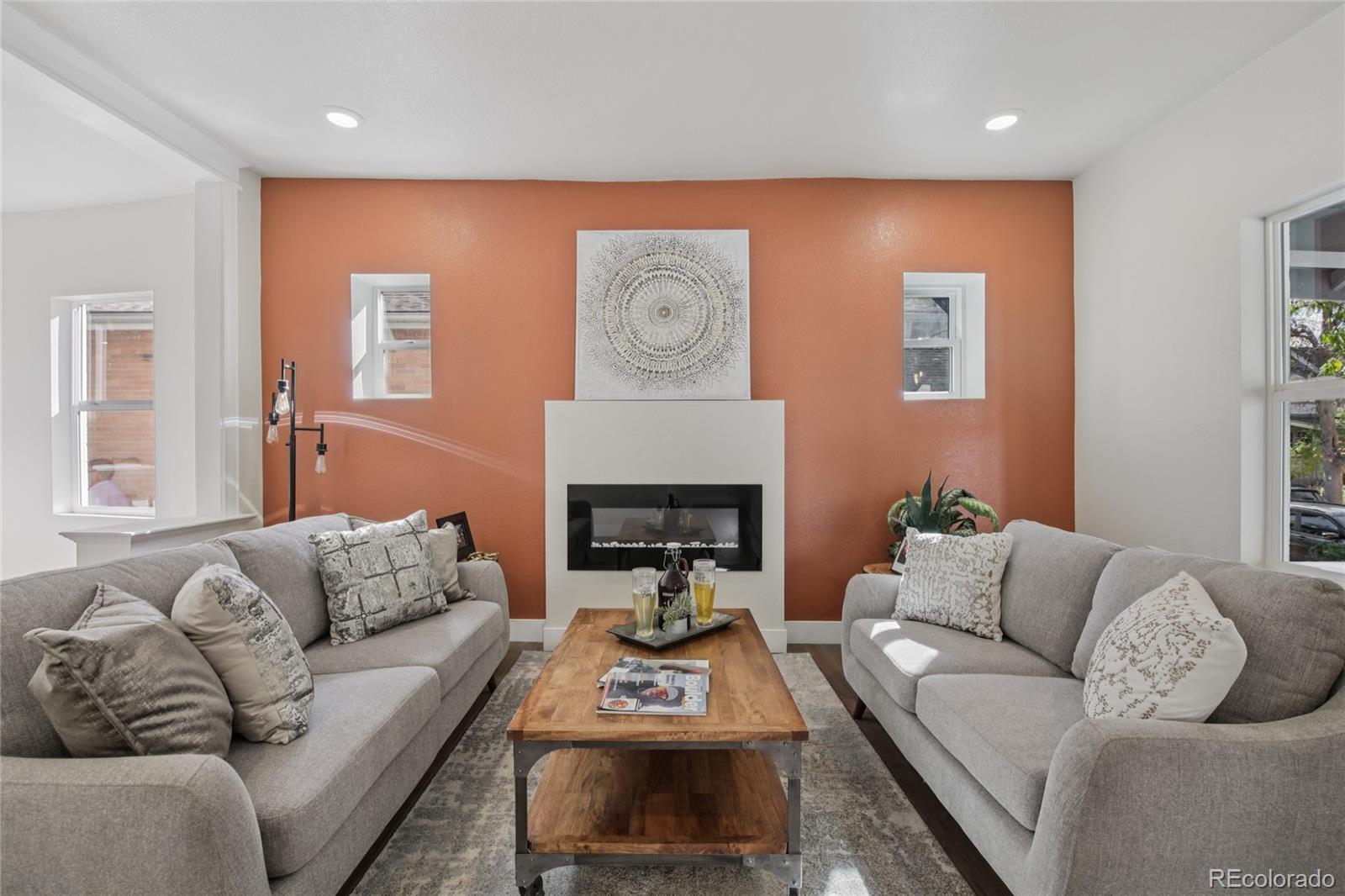 2342 Dexter Street Denver, CO 80207 - Photo 8 of 50 a living room with furniture and a fireplace