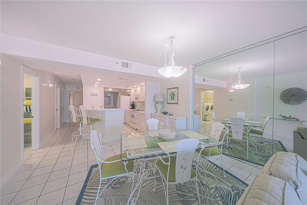 4575 South Atlantic Avenue, Unit 6607 Ponce Inlet, FL 32127 - Photo 11 of 48 a view of a dining room with furniture