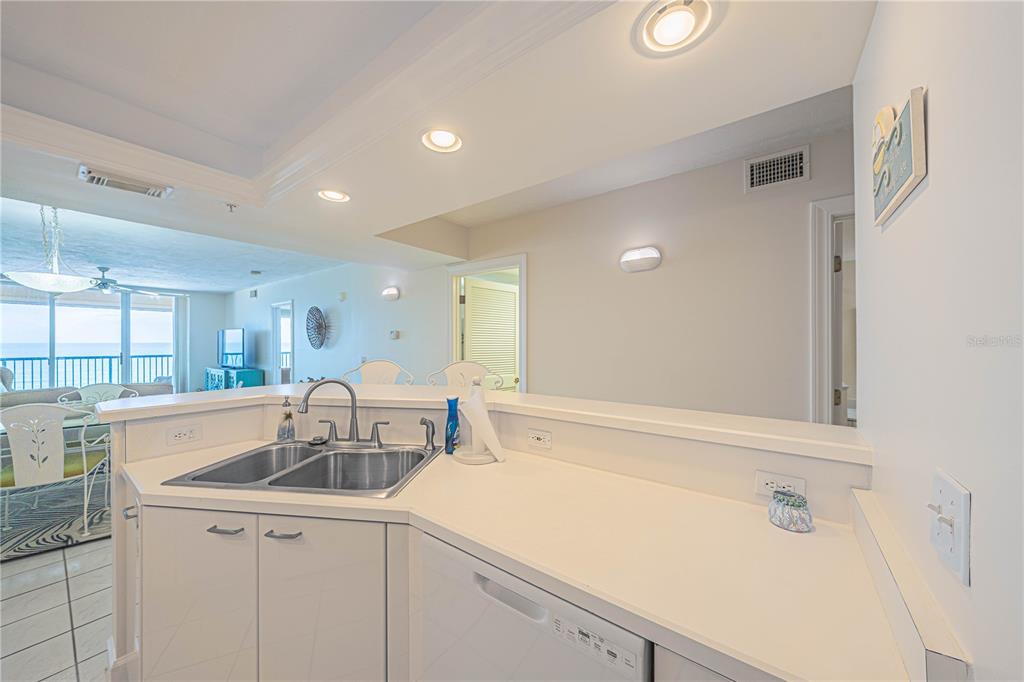 4575 South Atlantic Avenue, Unit 6607 Ponce Inlet, FL 32127 - Photo 14 of 48 a kitchen with a sink and cabinets
