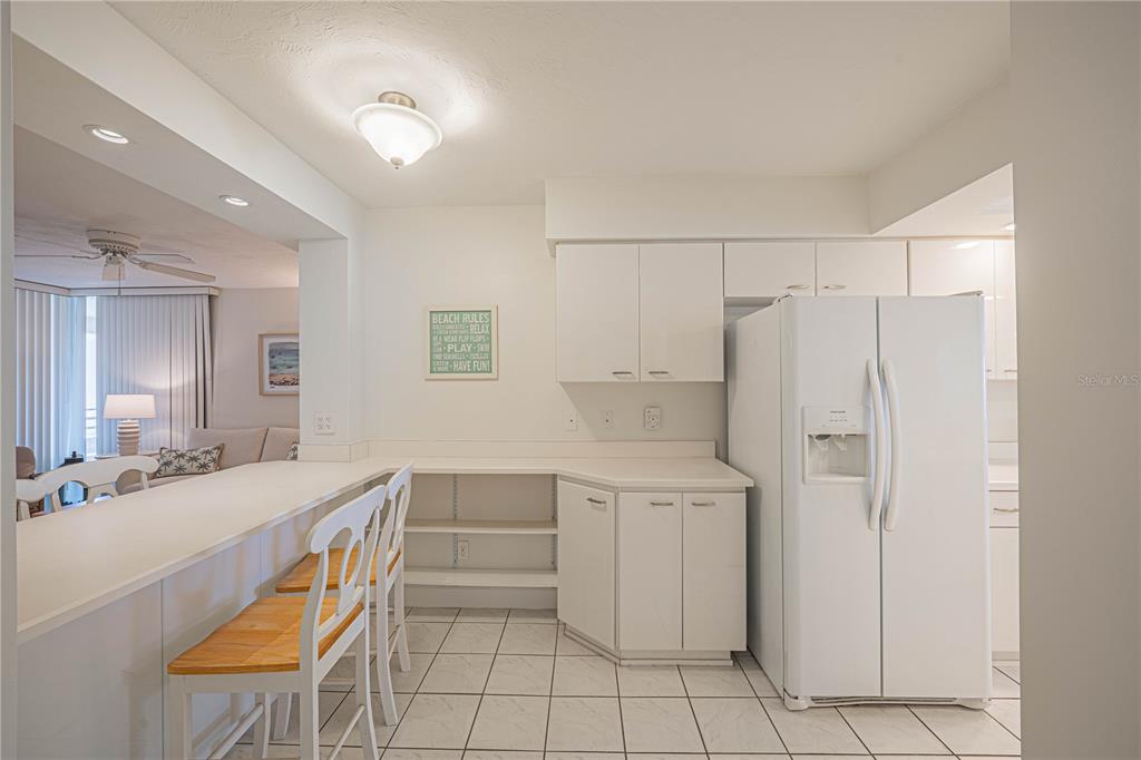 4575 South Atlantic Avenue, Unit 6607 Ponce Inlet, FL 32127 - Photo 16 of 48 a kitchen with stainless steel appliances a refrigerator and a sink