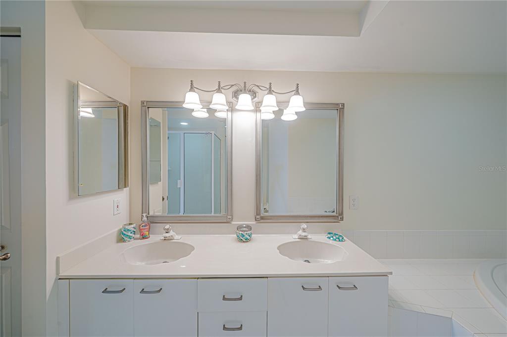4575 South Atlantic Avenue, Unit 6607 Ponce Inlet, FL 32127 - Photo 23 of 48 a bathroom with a sink and a mirror