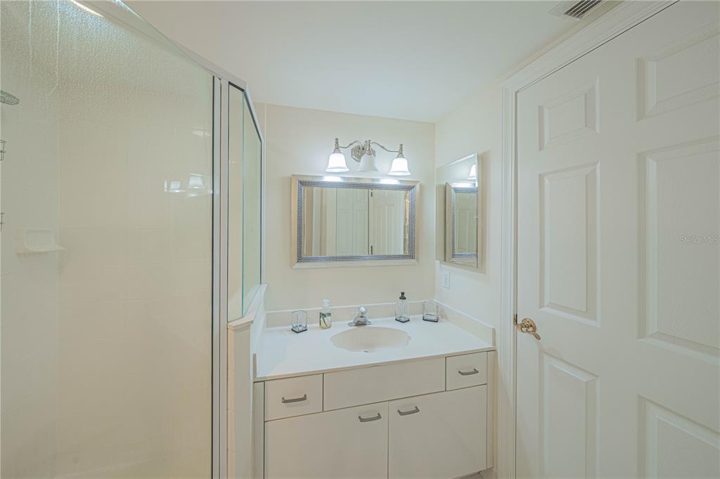4575 South Atlantic Avenue, Unit 6607 Ponce Inlet, FL 32127 - Photo 28 of 48 a bathroom with a sink vanity and mirror