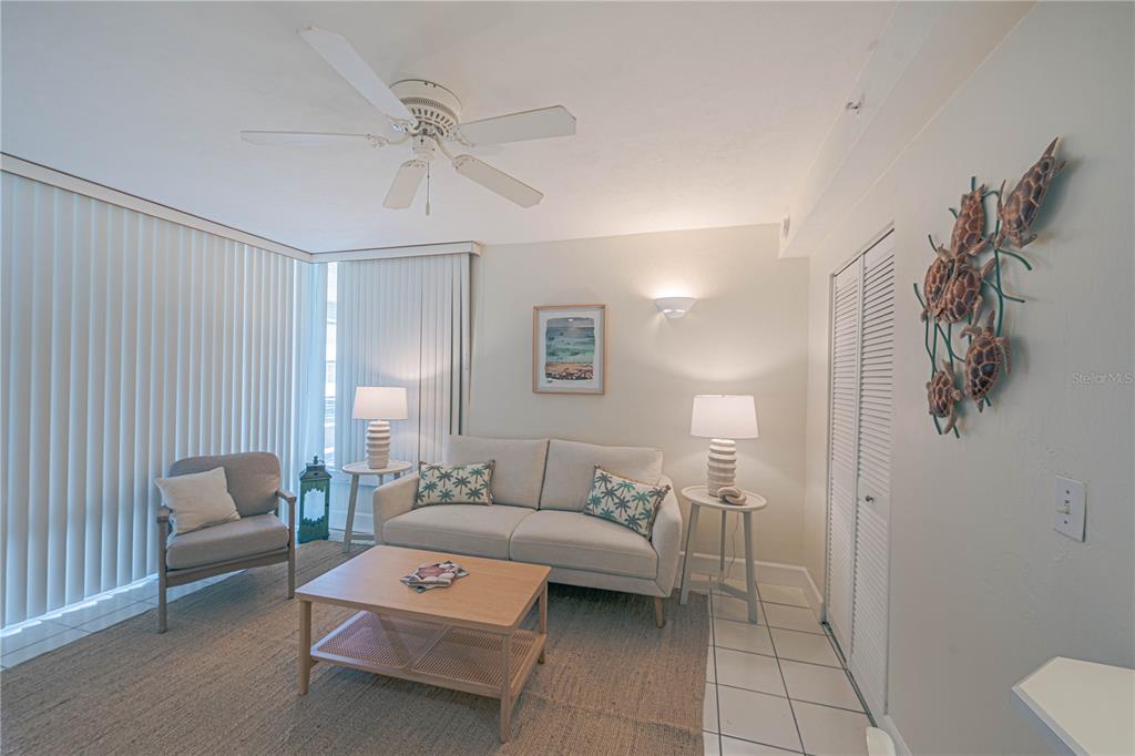 4575 South Atlantic Avenue, Unit 6607 Ponce Inlet, FL 32127 - Photo 31 of 48 a living room with furniture and a lamp
