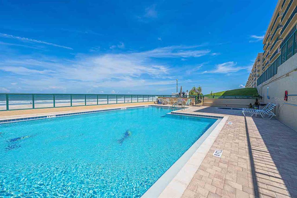 4575 South Atlantic Avenue, Unit 6607 Ponce Inlet, FL 32127 - Photo 38 of 48 a view of a swimming pool and an outdoor seating