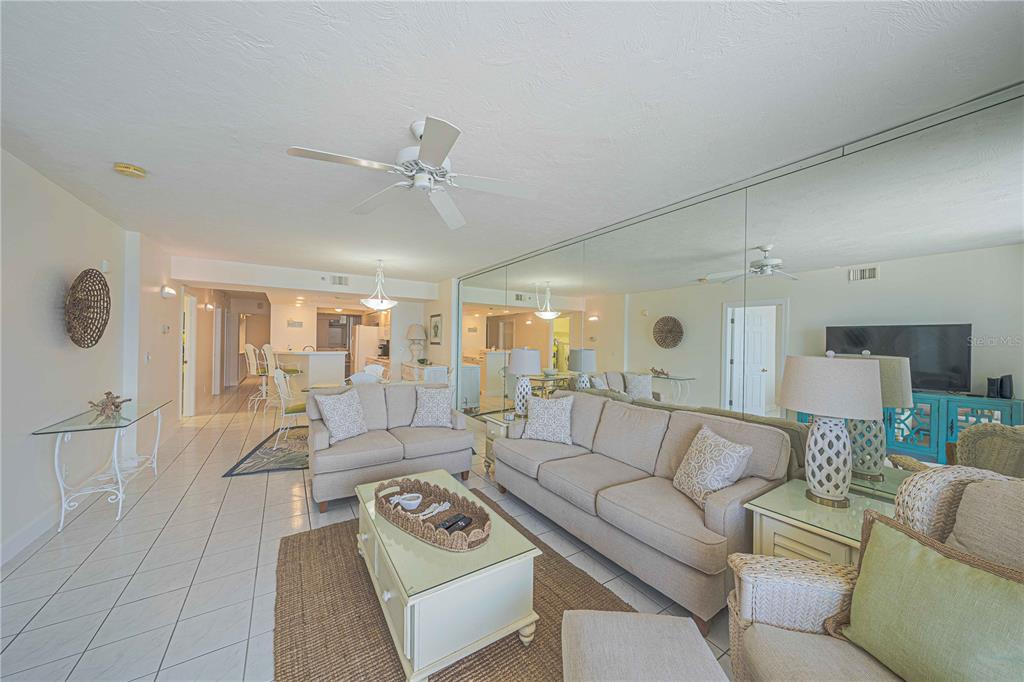 4575 South Atlantic Avenue, Unit 6607 Ponce Inlet, FL 32127 - Photo 9 of 48 a living room with furniture and a large window