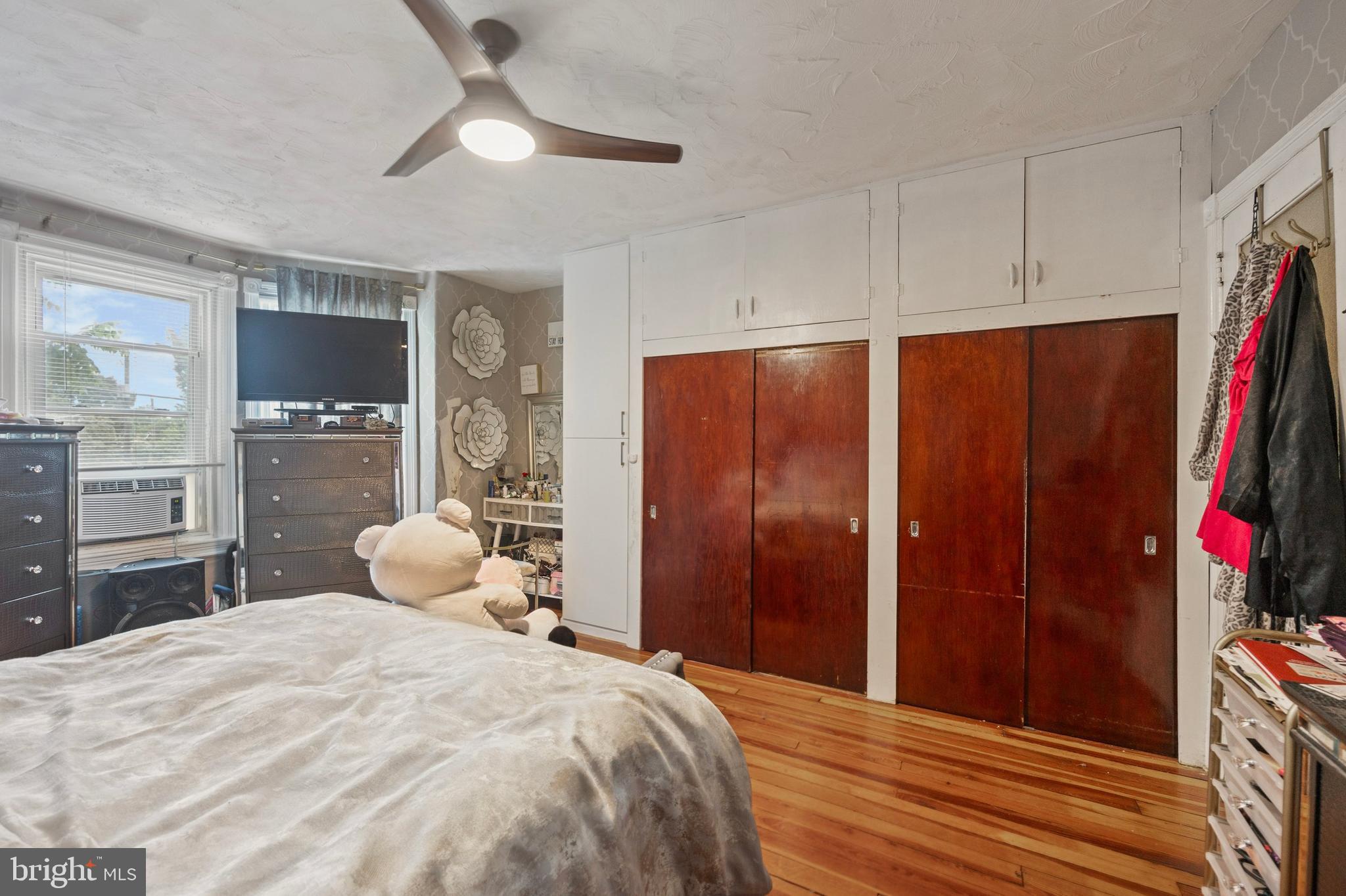 512 Crest Avenue Elkins Park, PA 19027 - Photo 14 of 24 a bedroom with a bed and a chandelier