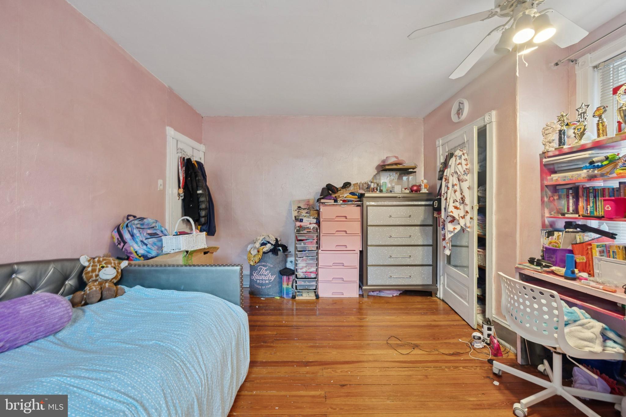 512 Crest Avenue Elkins Park, PA 19027 - Photo 17 of 24 a bed room with a bed and a book shelf