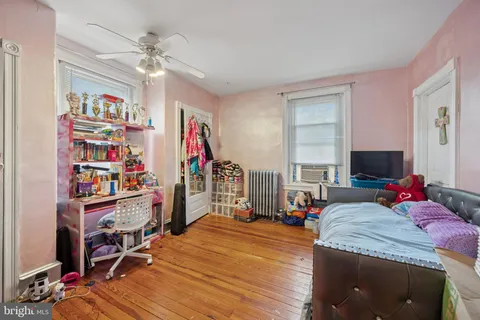 a bed room with a bed and a flat screen tv