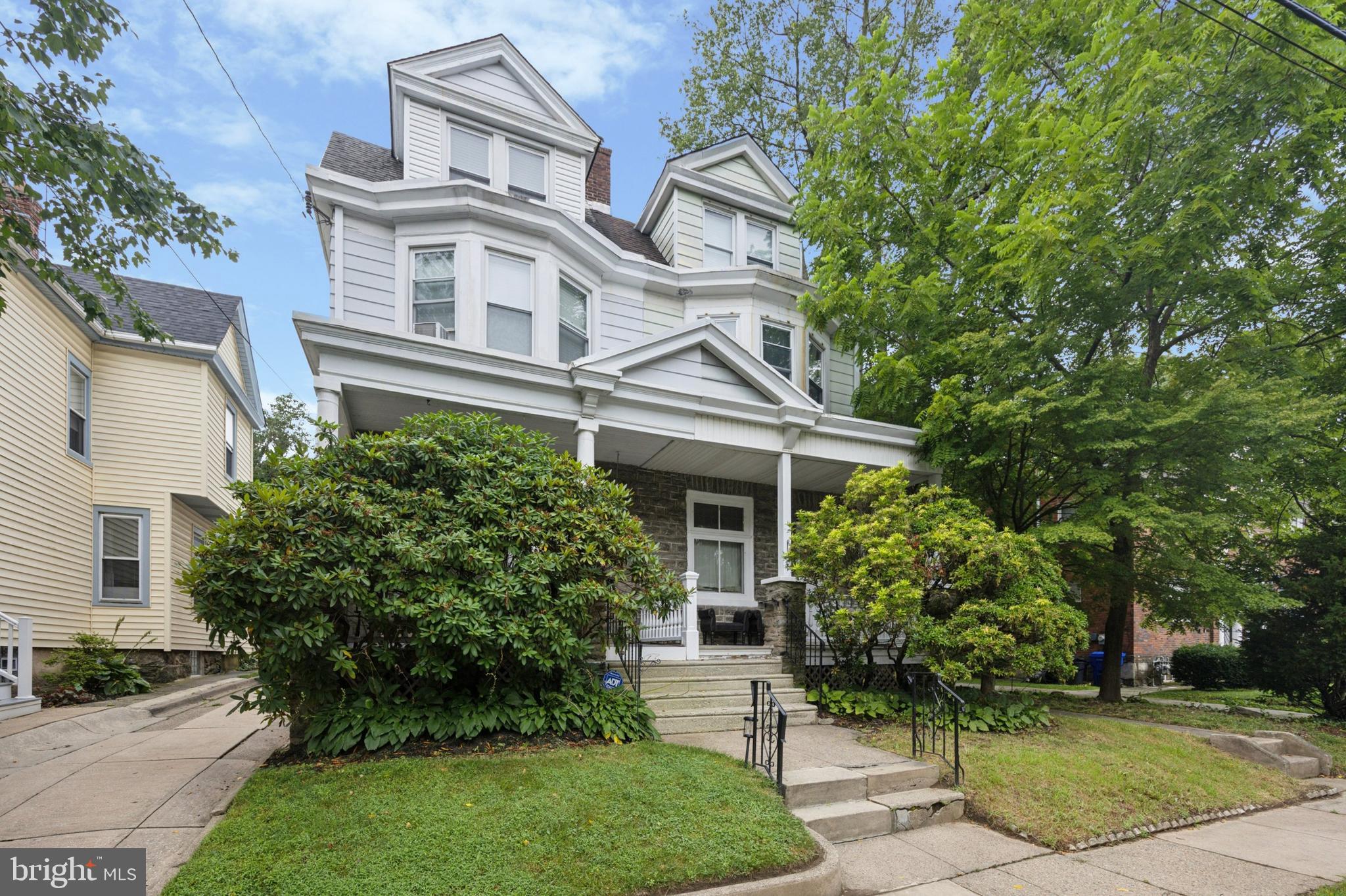 512 Crest Avenue Elkins Park, PA 19027 - Photo 2 of 24 a view of a white house next to a yard with big trees