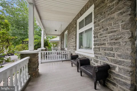 a balcony with furniture and a gate