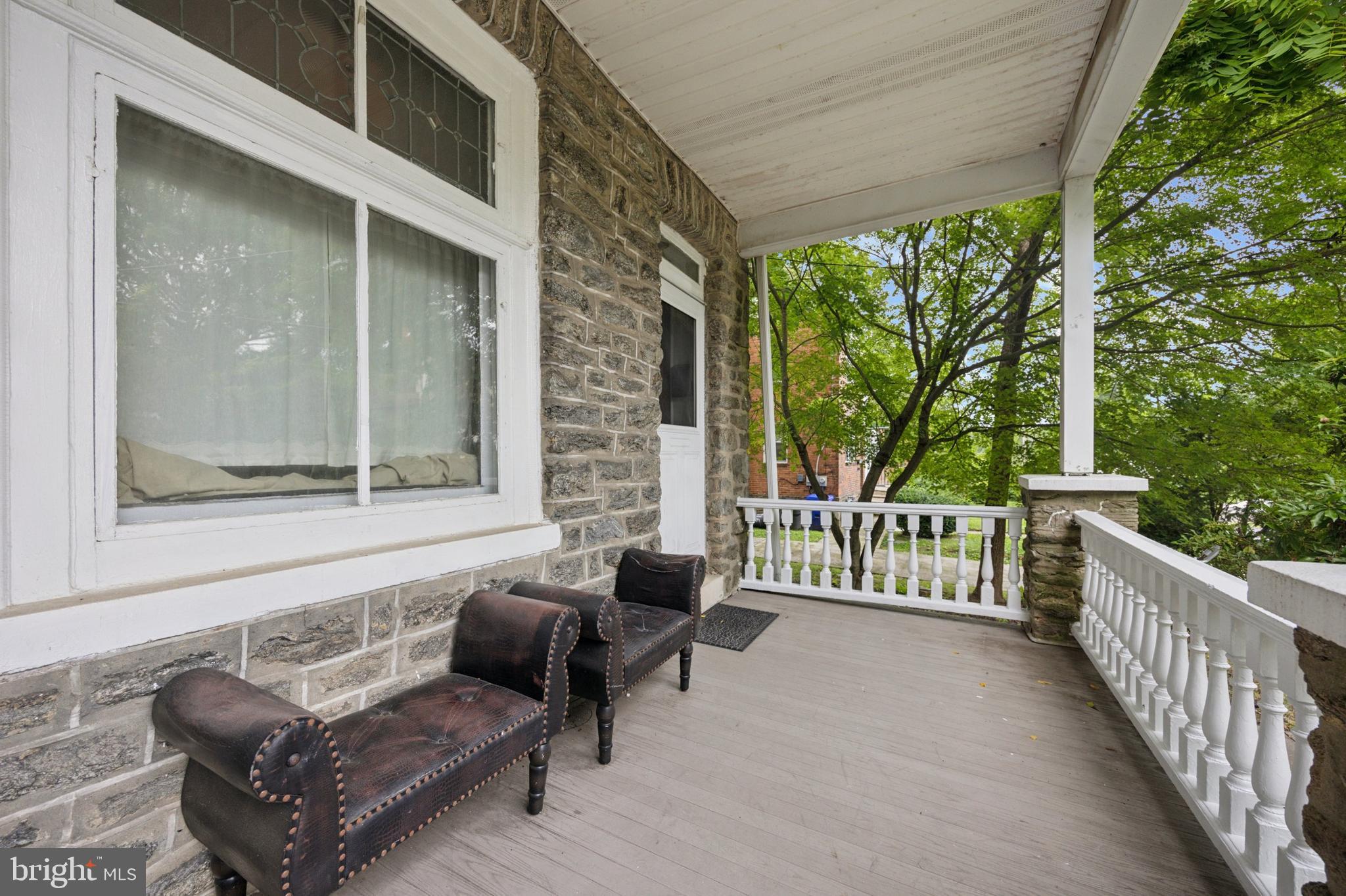 512 Crest Avenue Elkins Park, PA 19027 - Photo 4 of 24 a living room with patio furniture and a floor to ceiling window