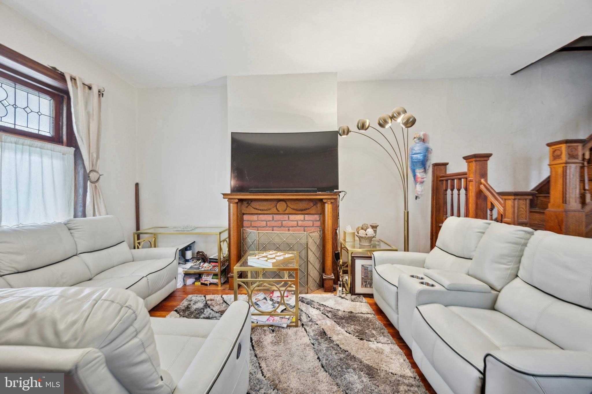 512 Crest Avenue Elkins Park, PA 19027 - Photo 6 of 24 a living room with furniture and a fireplace